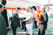 Nepals Prime Minister Baburam Bhattarai is welcomed by state Tourism Minister Madan Kaushik during 