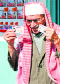 A man reacts after voting at a polling station at the Manar school in Tunis 