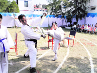 A student displays his judo skills at the annual sports meet of Doon Boys School in Dehradun on Monday. 