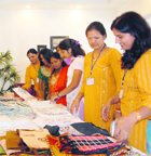 Women have a look at items at an exhibition put up by the Kamla Women Handicrafts Industries and Development Society, an NGO, in Dehradun on Monday. 