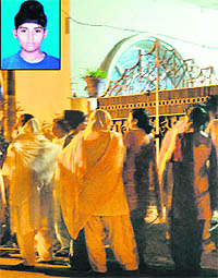 Neighbours gather outside the house of Amarinder Singh (inset), who was drowned in the Beas river on Sunday.