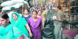 Women throng the Bartan Bazaar on the occasion of Dhanteras in Jalandhar on Monday.