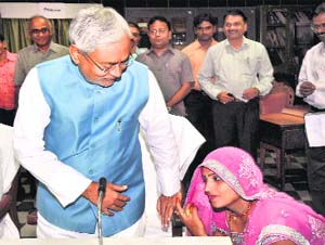 JD(U) MLA Kavita Kumari, who won the Daraunda Assembly byelection recently, seeks the blessings of Bihar Chief Minister Nitish Kumar after the oath-taking ceremony in Patna on Monday