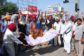 PRTC workers burn the effigy of the state government in Bathinda on Tuesday