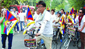 Tibetan students arrive at Jantar Mantar after completing Chandigarh to Delhi cycle rally to draw attention to the deteriorating situation in Ngaba, eastern Tibet, in New Delhi on Tuesday.
