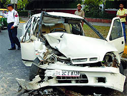 Police personnel managing the traffic after two cars collided at Ashok Road in New Delhi on Tuesday.