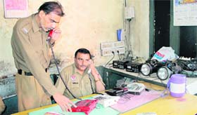 Firemen attend to calls at the complaint centre at the headquarters of the Fire department