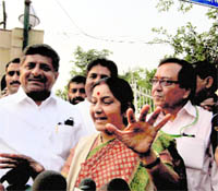 BJP leader Sushma Swaraj speaks to the media at Tihar Jail in New Delhi on Tuesday after meeting party leaders jailed in connection with the cash-for-vote scam