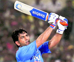 M S Dhoni plays a shot during the final ODI at Eden Gardens in Kolkata on Tuesday. India beat England by 95 runs to win the series 5-0