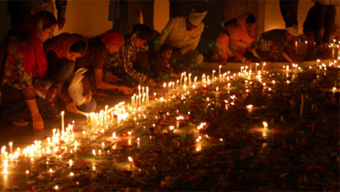 People lighting candles at the historic gurudwara in Qila Mubarak to celebrate Diwali on Wednesday evening. A Tribune photograph