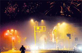 Fireworks light up the sky even as smog was visible across the city late on Diwali night.
