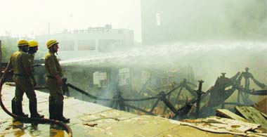 Firefighters try to douse the flames at Jaipuria Mill near Ghanta Ghar in Old Delhi on Thursday morning.