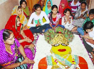 Devotees perform Govdardhan Pooja, organised by the Yuva Sanskritik Sanghthan at Arya Pura, Old Subzi Mandi in Old Delhi on Thursday. 