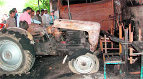 A tractor and other property damaged in a fire in a shop in the Kargi area of Dehradun on Wednesday.