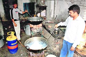 Sweets being prepared in unhygienic conditions at a sweets shop in Rohtak.