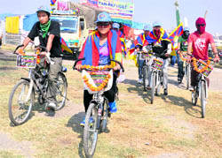 Activists of the Tibetan Youth Congress on a cycle rally from Chandigarh to New Delhi cross Karnal