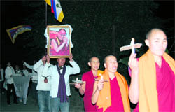Tibetans hold a candlelight march in Dharamsala on Friday