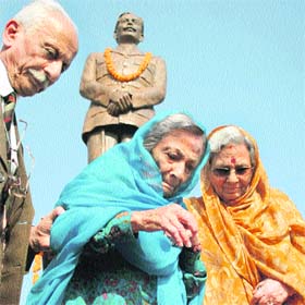 Bimla Pathania (centre) and Usha Parmar (right), daughters of Brig Rajinder Singh, attend their fathers martyrdom day function in Jammu on Thursday