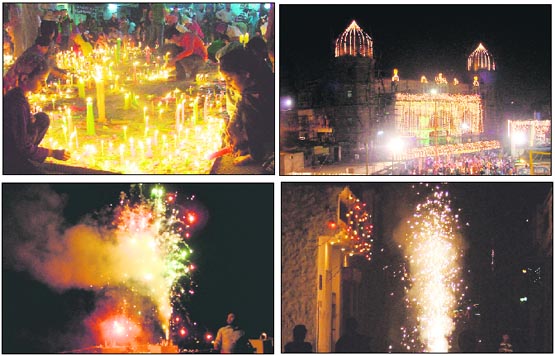 Residents light candles at Gurdwara Dukhnivaran Sahib. An illuminated Gurdwara Dukhnivaran Sahib lends a colourful touch to Diwali. Onlookers silhouetted against an illuminated street during Diwali celebrations in Ludhiana on Wednesday. The sky is illuminated as a resident lights fireworks in Ludhiana.