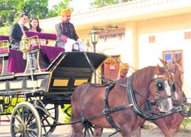 Bhutans King Jigme Khesar Namgyel Wangchuk and Queen Jetsun Pema arrive on a horse carriage at the Rambagh Palace in Jaipur on Thursday