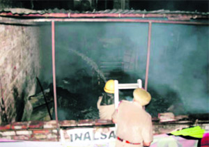 Firemen douse a fire in Patiala on Thursday. 