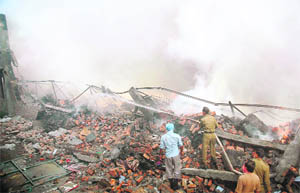 Firemen try to douse the flames after an export unit caught fire in Amritsar on Friday.
