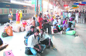 Passengers stranded at the railway station in Amritsar on Friday. 