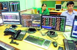 Stockdealers during intraday trade at a brokerage house in Mumbai. Stocks rose as much as 3.58% or 619.3 points to 17,908.13 intraday on the BSE on Friday on improved risk appetite after a Eurozone meeting to resolve the region's debt crisis