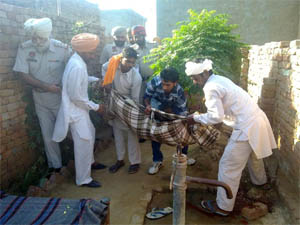 The body of the accused being carried away on Friday.