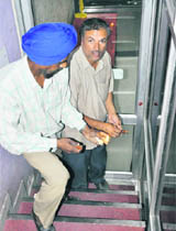 Estate officials seal the basement of Healthyway Immigration Consultancy at Sector 42 in Chandigarh on Friday.
