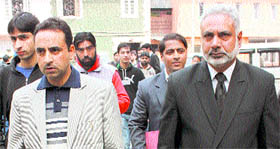 Mushtaq Ahmad Dar, the counsel who is pleading the case against Omar and Farooq Abdullah, heads towards the court premises on Friday.