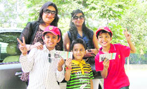 Payel Jain, Snehal Jindal, Ritu Goyal, Harshel Jain and Aditya Goyal proudly display their tickets while posing for a picture before leaving for the Buddh International Circuit to witness Indias first Formula 1 Grand Prix, in Ludhiana on Friday. 