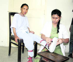 Pema Charba, a Tibetan refugee, who suffered from urinary incontinence and weakness of limbs. 