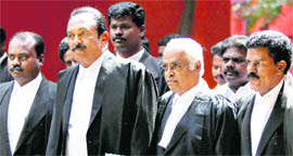 MDMK general secretary Vaiko (second from left) comes out of the Madras High Court after representing Rajiv Gandhi's assassins in Chennai on Friday.