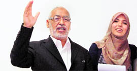 Founder of the moderate Islamist Ennahda party Rached Ghannouchi with his daughter, Intissar Kherigi, at the partys headquarters in Tunis on Friday.