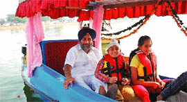 Deputy Chief Minister Sukhbir Singh Badal enjoys a ride in a shikara with his children at the thermal lake in the city on Saturday.