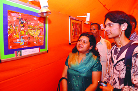 Visitors at a painting exhibition on Ramayan, Indian art to the eyes of Japan, that showcases works of children from Japan, at the Sri Ram Bharatiya Kala Kendra in New Delhi on Saturday. 