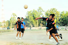 Players in action in the District Handball Tournament played at the Parade Ground in Dehradun on Saturday. 
