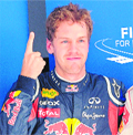 Sebastian Vettel gestures after racing to a record 16th pole position with a lap timing of 1:24.178.