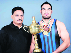 Wrestler Manav Khullar along with his coach GS Sangha.