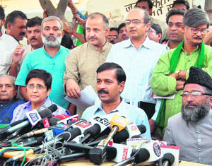 Civil society members Arvind Kejriwal, Kiran Bedi, Shanti Bhushan and Prashant Bhushan address the media after their core committee meeting. 