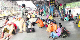 Passengers wait for their trains at Patiala Railway Station on Saturday.