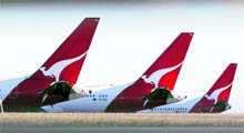 Qantas planes are seen grounded at Perth international airport on Saturday