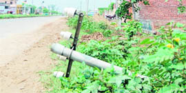 A damaged telephone pole on the airport road in Amritsar.
