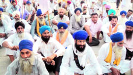 Farmers protest outside Nijjar-Agro factory in Amritsar on Sunday.