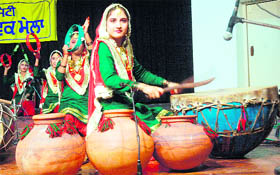 Students play folk instruments during the youth festival at GND University in Amritsar on Sunday.