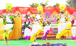 Students perform bhangra in memory of Shaheed Bhagat Singh at Khuda Ali Sher in Chandigarh on Sunday.