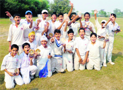 Winners strike a pose with their trophies in Patiala on Sunday.