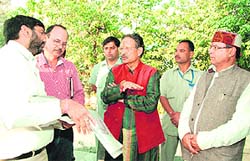 Uttarakhand Chief Minister BC Khanduri inspects work on a shopping complex being built for Chakrata shopkeepers near the Clock Tower in Dehradun on Sunday.