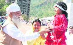HS Hanspal, member, Minority Commission, Delhi, gives a prize to a student at Baru Sahib on Sunday. 